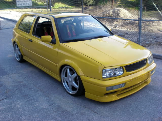 Yellow 1999 VW GTI VR6, front passenger-side three-quarter view