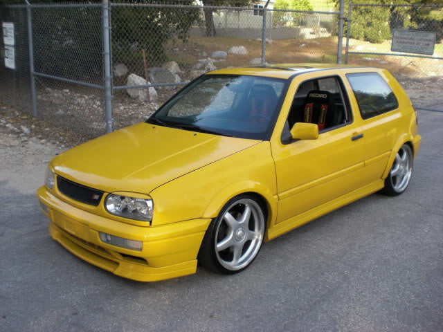 Yellow 1999 VW GTI VR6, front driver-side three-quarter view