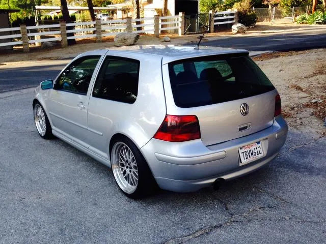 Silver 2002 VW GTI 337, driver-side rear three-quarter view